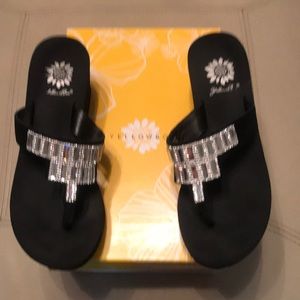 Yellow Box between the toe slides with rhinestone accents. 2 inch wedge Black.